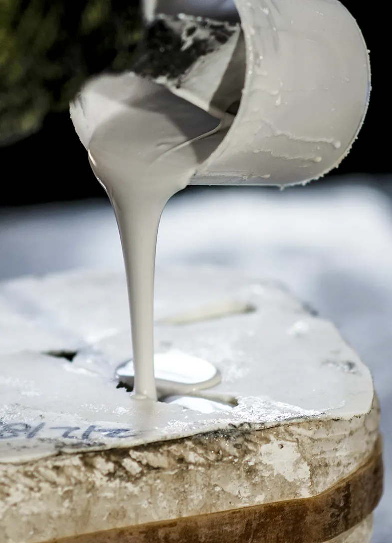 Pouring resin into a cast